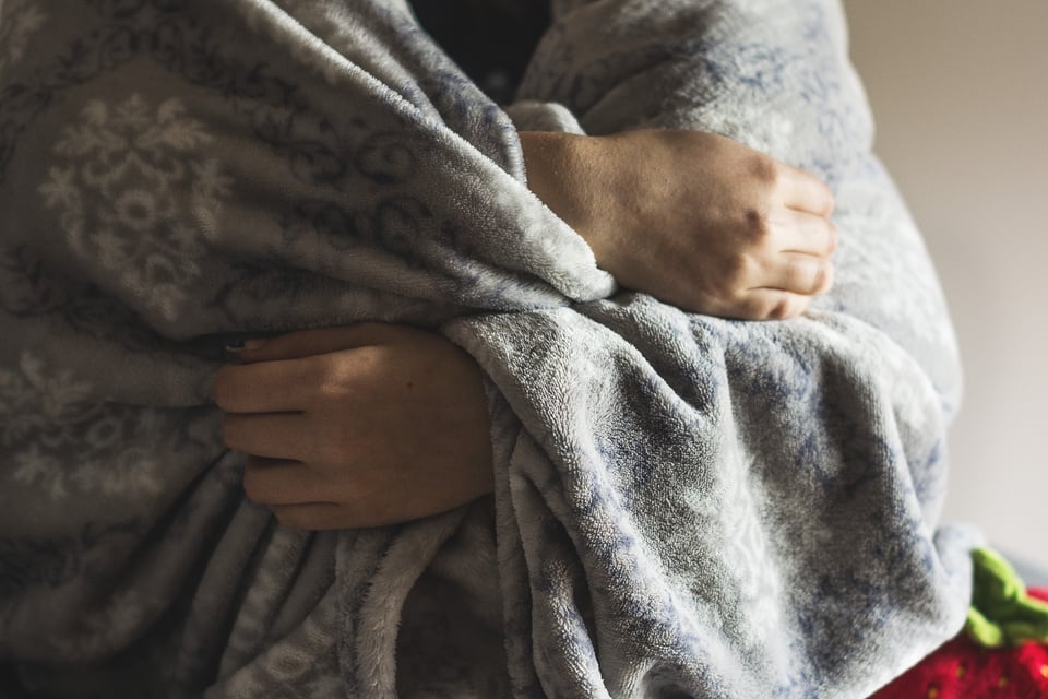 Person Covered with a Blanket